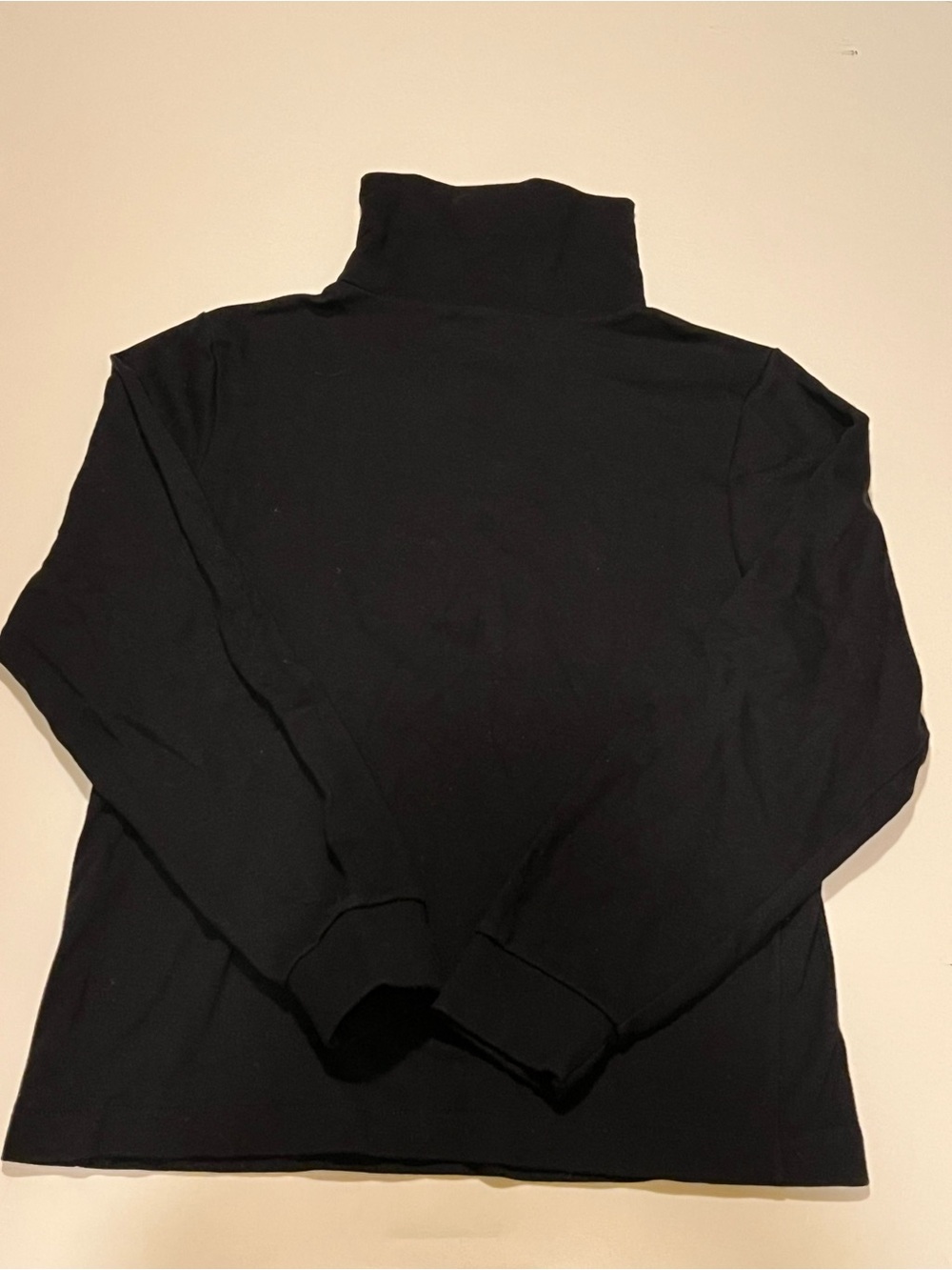 GIRL’S COPPER KEY BLACK TURTLENECK.